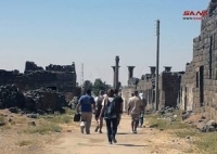 مجموعة سياحية من إسبانيا والأرجنتين تزور مدينة بصرى الشام