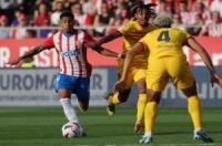 جيرونا يتغلب على برشلونة برباعية ويهدي ريال مدريد لقب الدوري